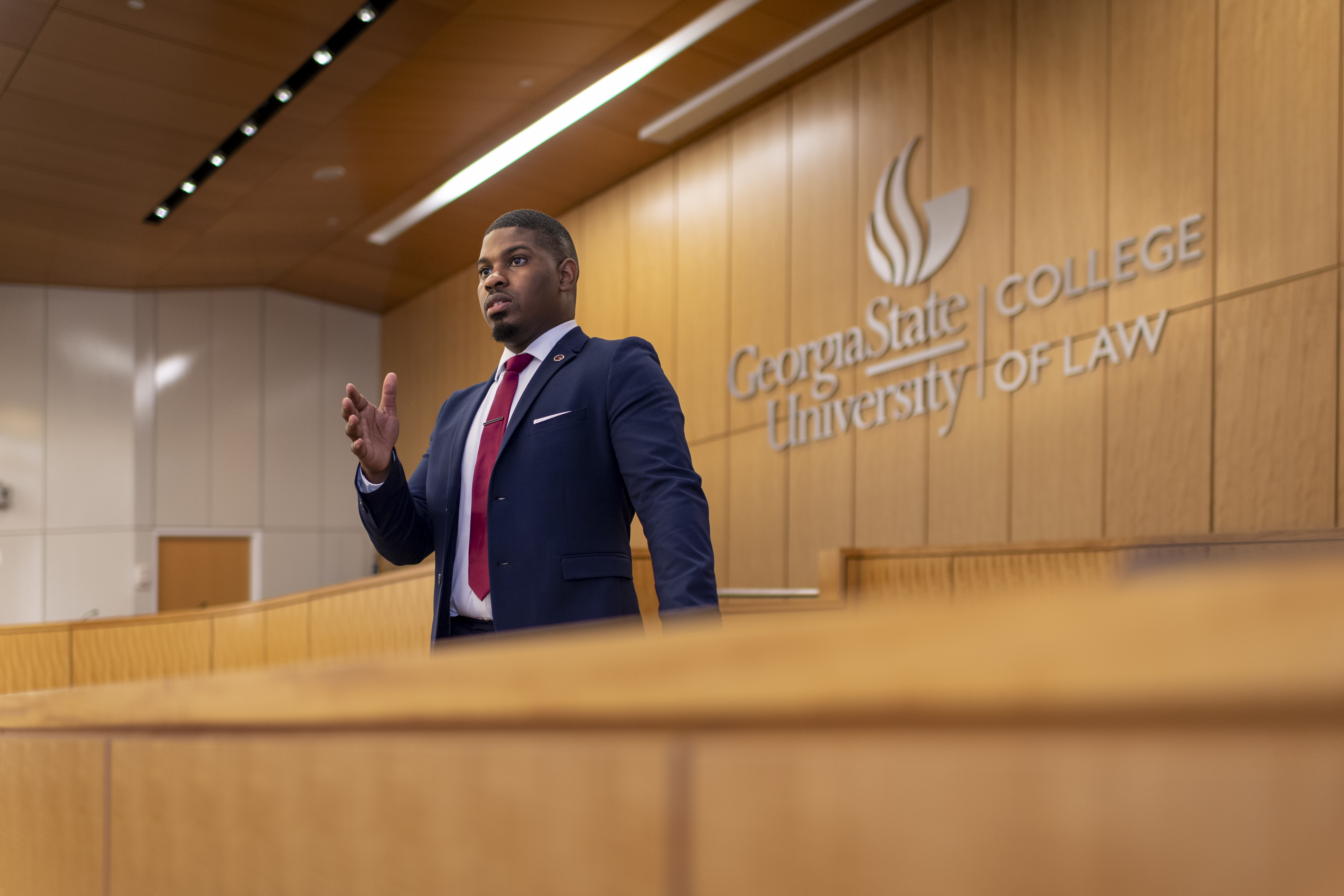 College of Law student preparing in a courtroom.